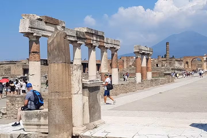 Pompeii ruins with Mount Vesuvius backdrop, a highlight day trip on a 6-day private tour from Rome