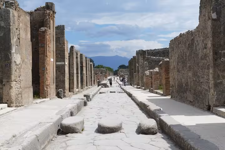 Walk through the historic streets of Pompeii, capturing the essence of Roman life on a skip the line tour.