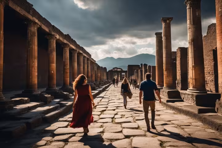 Visitors exploring the iconic stone streets of Pompeii under dramatic skies on a private tour.