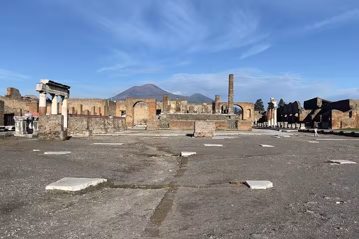 Explore the ancient ruins of Pompeii with Mount Vesuvius in the background on our all-inclusive Amalfi Coast tour.