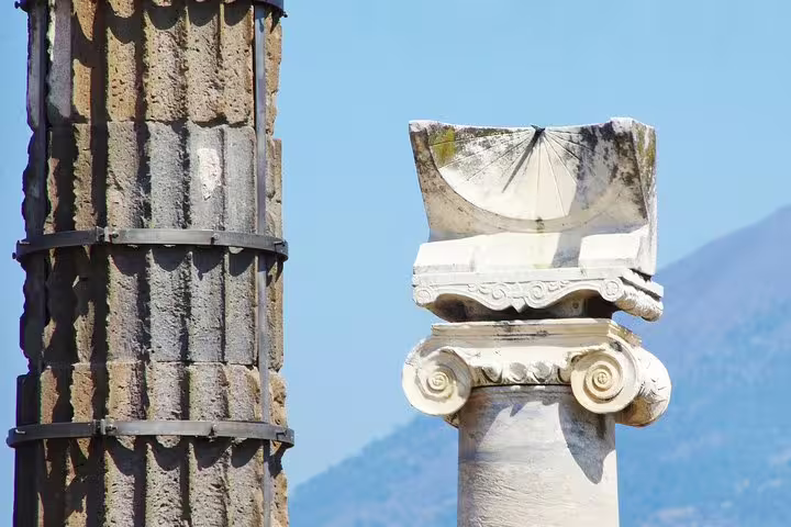 Ancient Pompeii columns and capital detail on VIP guided small-group tour with skip-the-line ticket