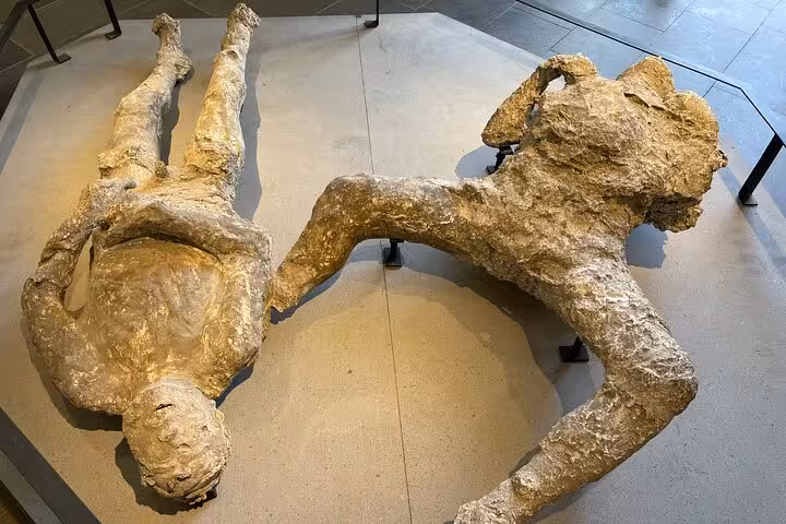 See eerily preserved plaster casts of Pompeii victims, frozen in time, during your all-inclusive tour from Positano.