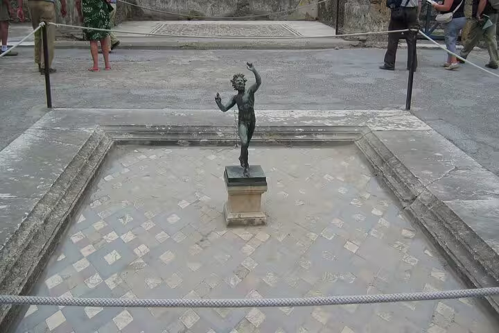 Pompeii ruins VIP small-group tour from Naples featuring House of the Faun bronze statue and mosaics