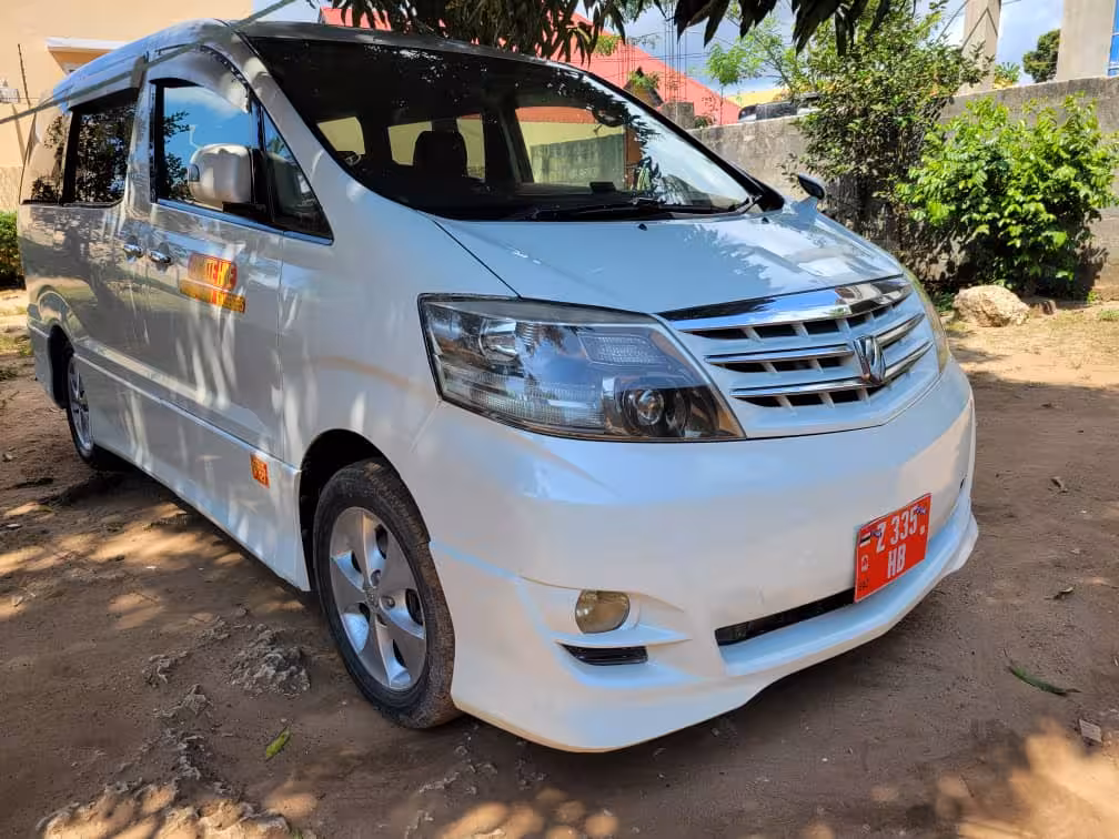 Clean white minibus used for reliable door-to-door private transfer service from Pongwe hotels to Zanzibar Airport ZNZ.