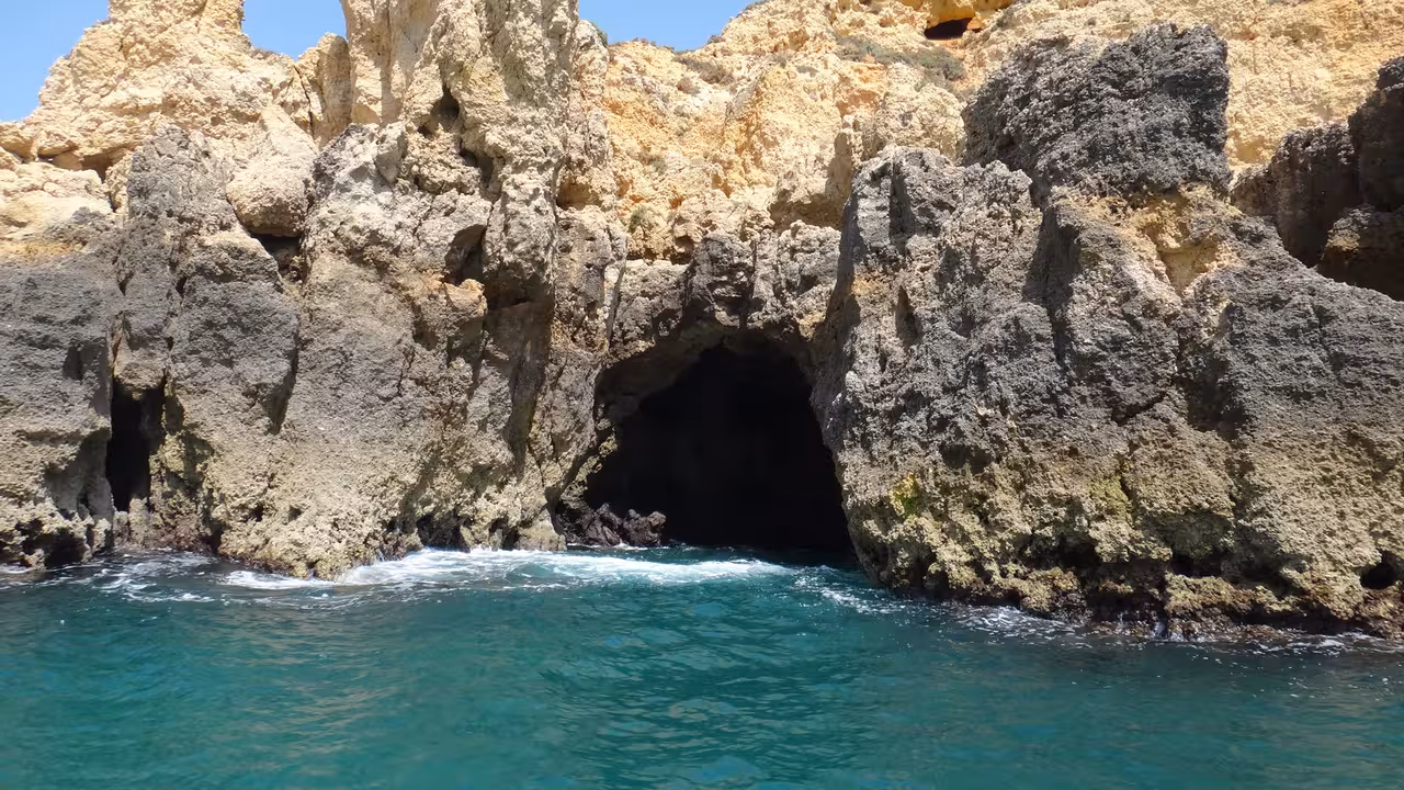 Boat view of sea cave entrance at Ponta da Piedade, Lagos Algarve on express grotto tour