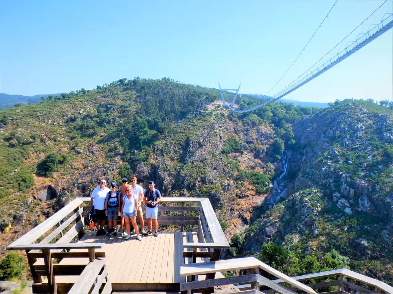 Group at viewpoint with Ponte 516 Arouca suspension bridge on guided day trip from Porto, Portugal