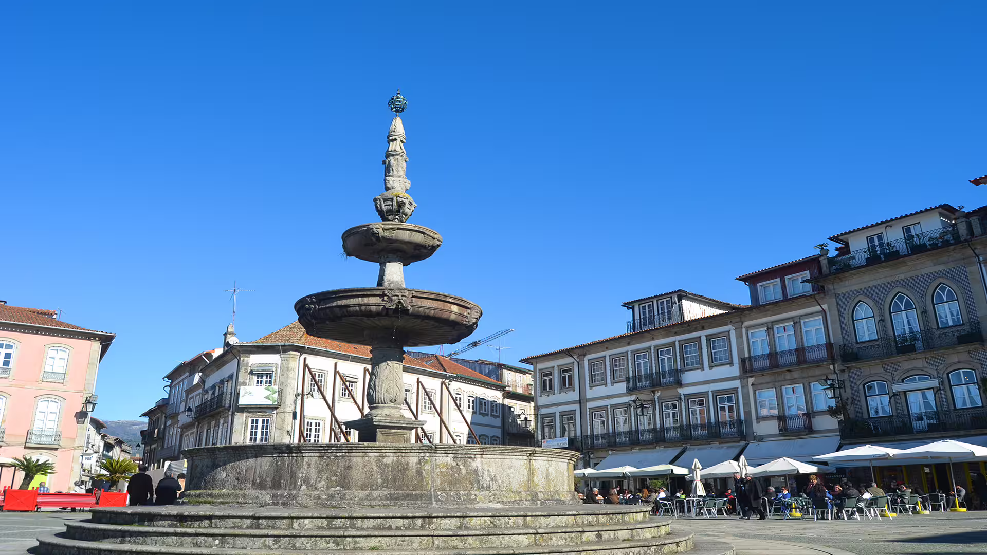 Historic stone fountain in Ponte de Lima's charming square, perfect for exploring on a private Vinho Verde region tour.