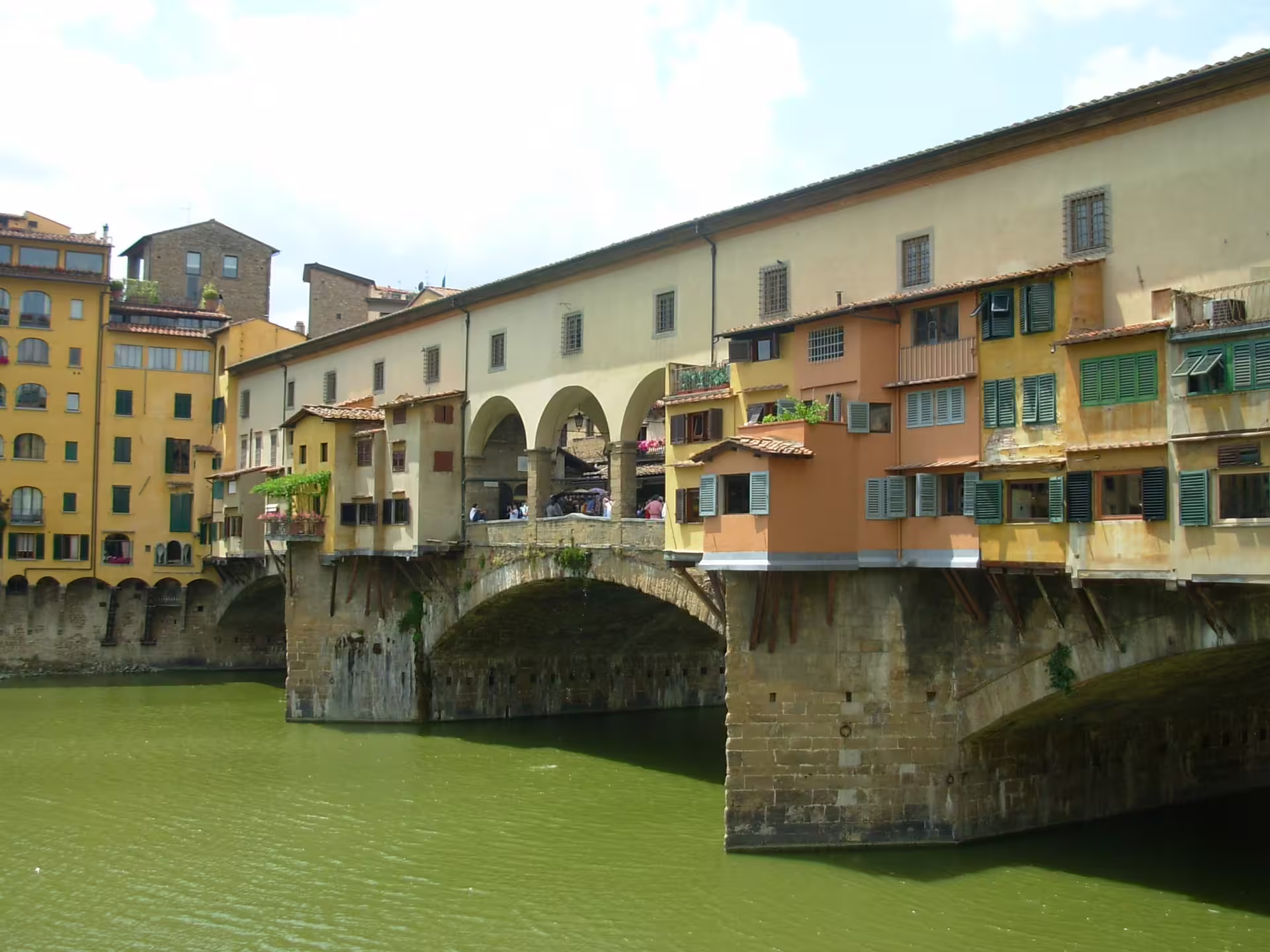 Ponte Vecchio bridge in Florence reflected in the Arno River, a highlight of the 9 days self drive Divine Country Tour Italy