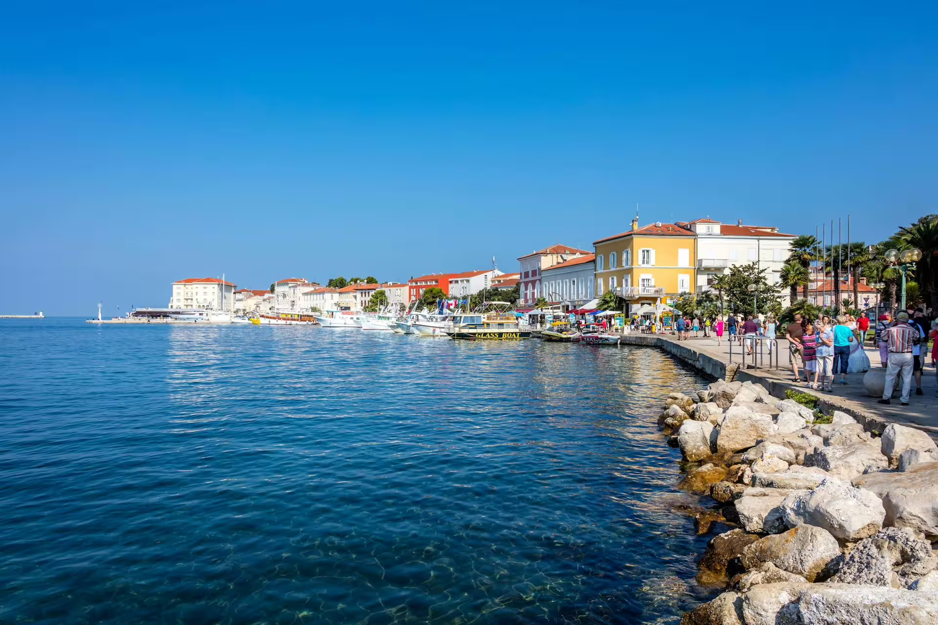 Poreč waterfront promenade with boats and Adriatic views, scenic stop on the Ancient Istria day tour from Pula