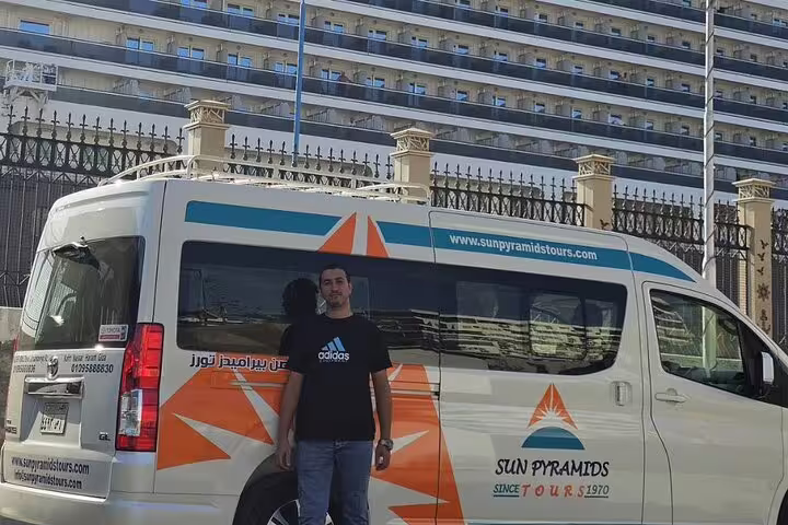 Guest beside Sun Pyramids Tours van for Port Said to Giza Pyramids excursion with Nile River lunch included