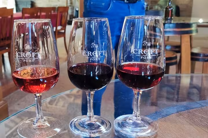 Port wine tasting in Pinhão, Douro Valley, with three glasses of ruby and tawny Port at a winery