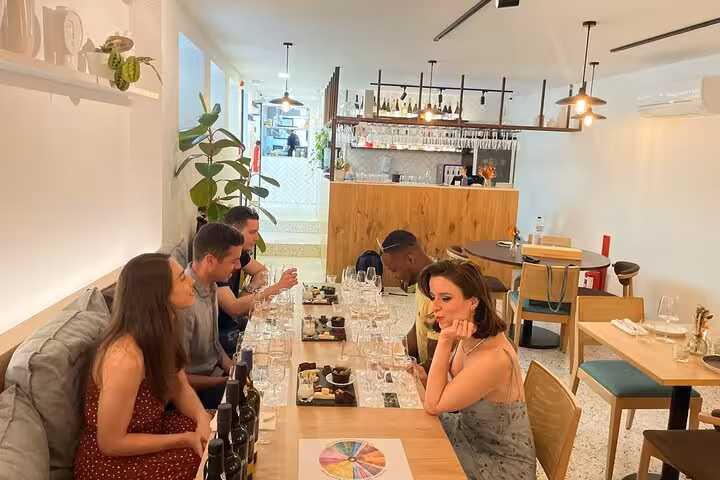 Small-group Port wine tasting with a sommelier in a modern wine bar, featuring five-port flight, bites, and aroma wheel.