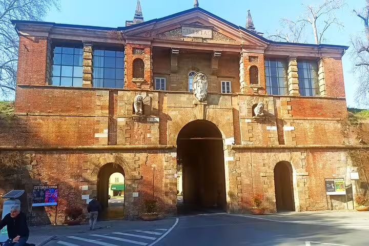 Historic Porta San Pietro gate in Lucca, Italy, visited on a private Pisa and Lucca wine tasting and lunch excursion