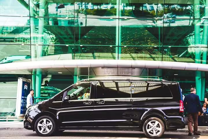 Luxurious black van ready for Porto airport private arrival transfer, offering premium comfort and convenience.