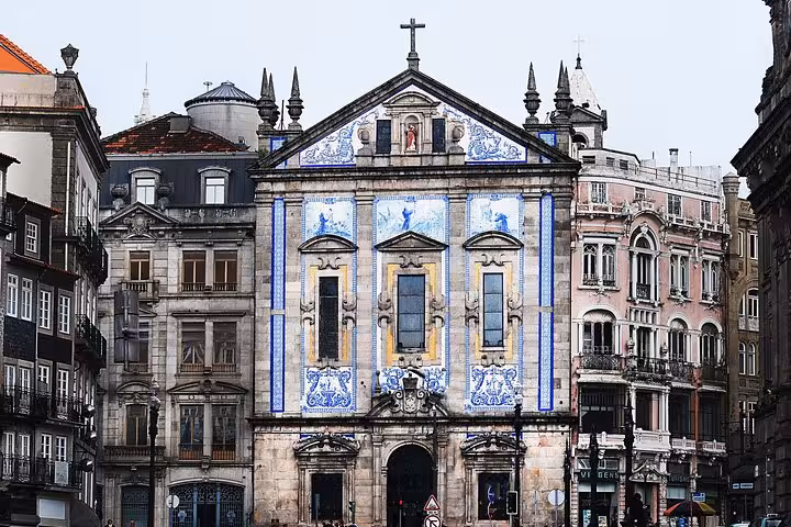 Beautiful azulejo-tiled church facade in Porto, featured on the 7-day guided tour from Madrid to Portugal.