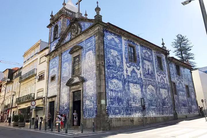 Historic Porto church adorned with stunning blue azulejos tiles, a highlight of the Lisboa to Porto Private Full-Day XL Tour.