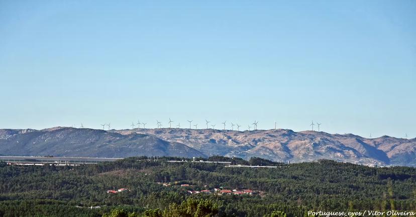 Scenic view of Caramulo mountains with wind turbines, highlighting the natural beauty on the Porto to Caramulo transfer route.