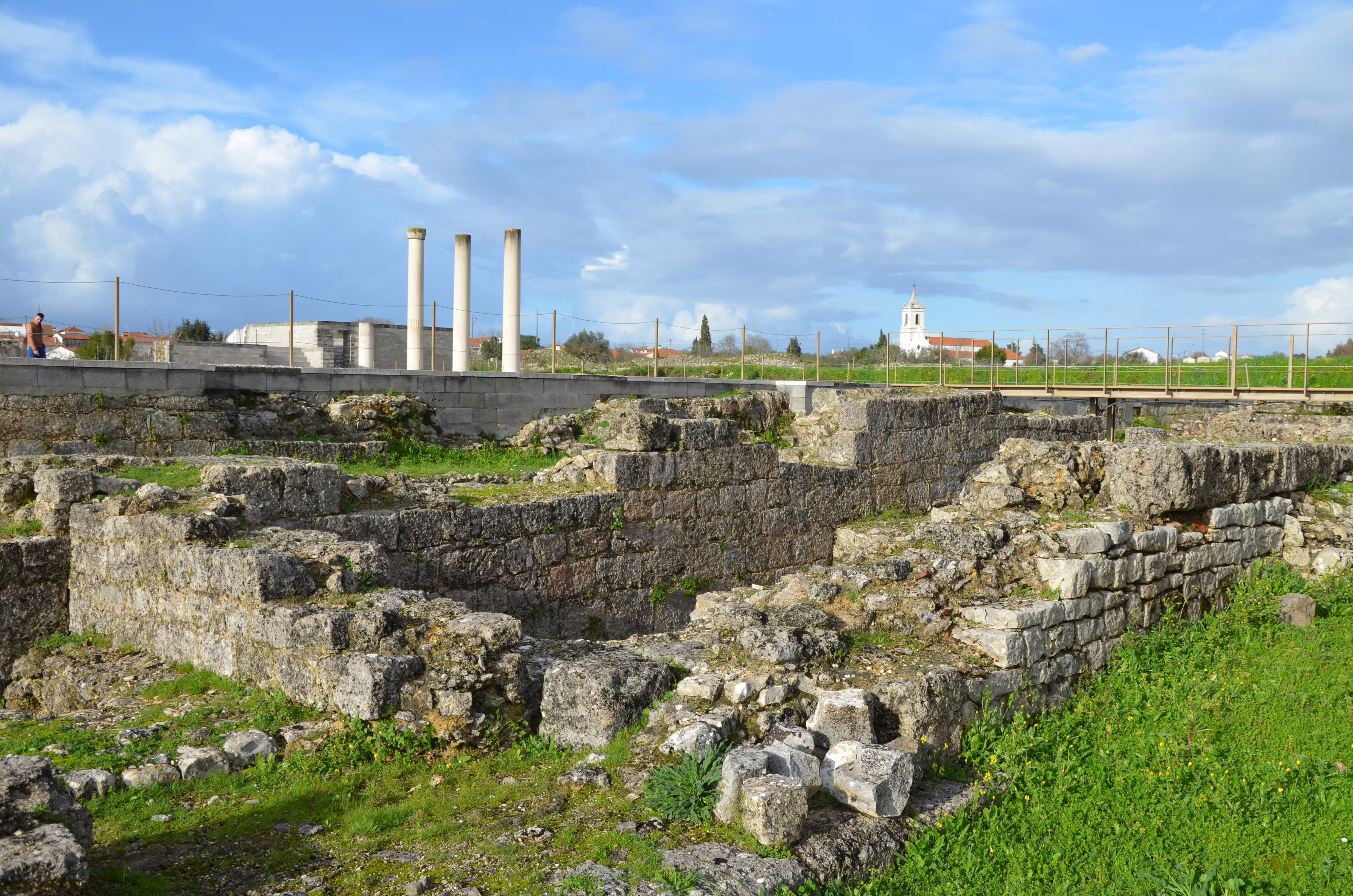 Roman ruins of Conimbriga under blue skies, a highlight on the Porto to Castelo Branco car transfer journey.