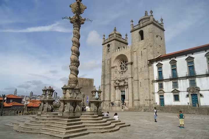 Visit Porto Cathedral's majestic architecture and historic square on an e-bike tour with insights from a local guide.