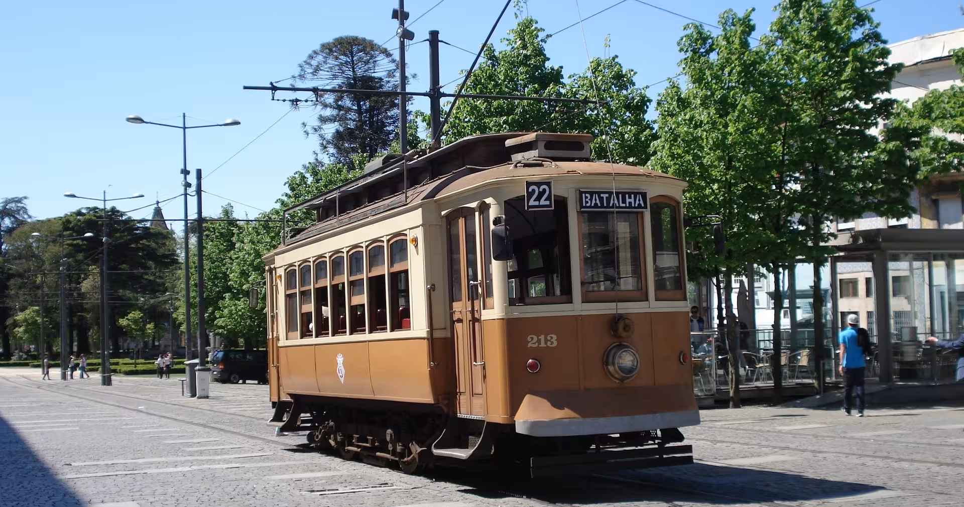 Classic Porto tram on city street, seen on a half-day walking tour with local guide in a small group
