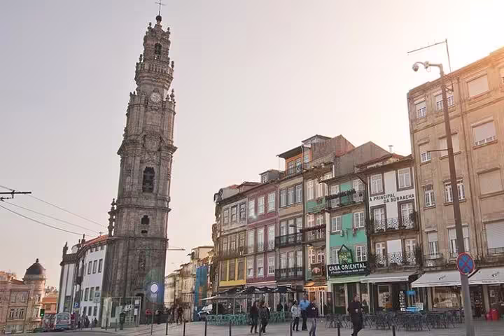 Historic Porto cityscape featuring Clérigos Tower and colorful buildings, perfect for a private full-day tour from Lisbon.