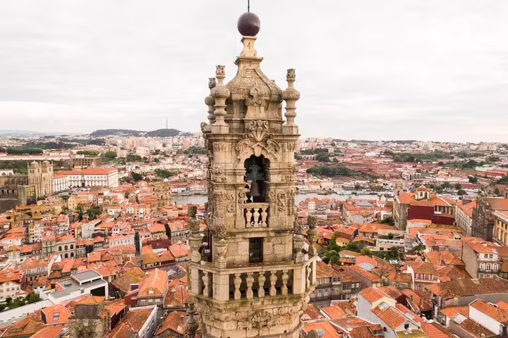 Discover Porto's historic Clerigos Tower with panoramic city views, a highlight of the half-day tour and river cruise.