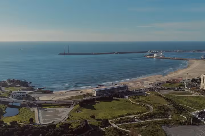Aerial view of Porto coastline and sandy beach stop on half-day small-group Porto & seaside tastings tour