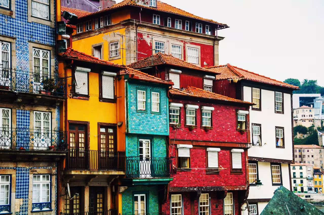 Colorful traditional buildings in Porto, North Portugal, showcasing vibrant architecture on a self-drive tour exploring the region's healing waters.