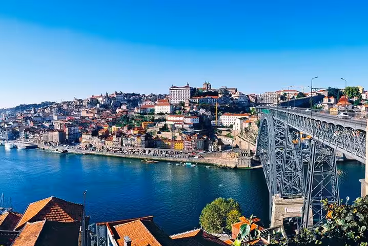 Porto Ribeira skyline and Dom Luís I Bridge over Douro River, highlight on Porto–Santiago transfer route