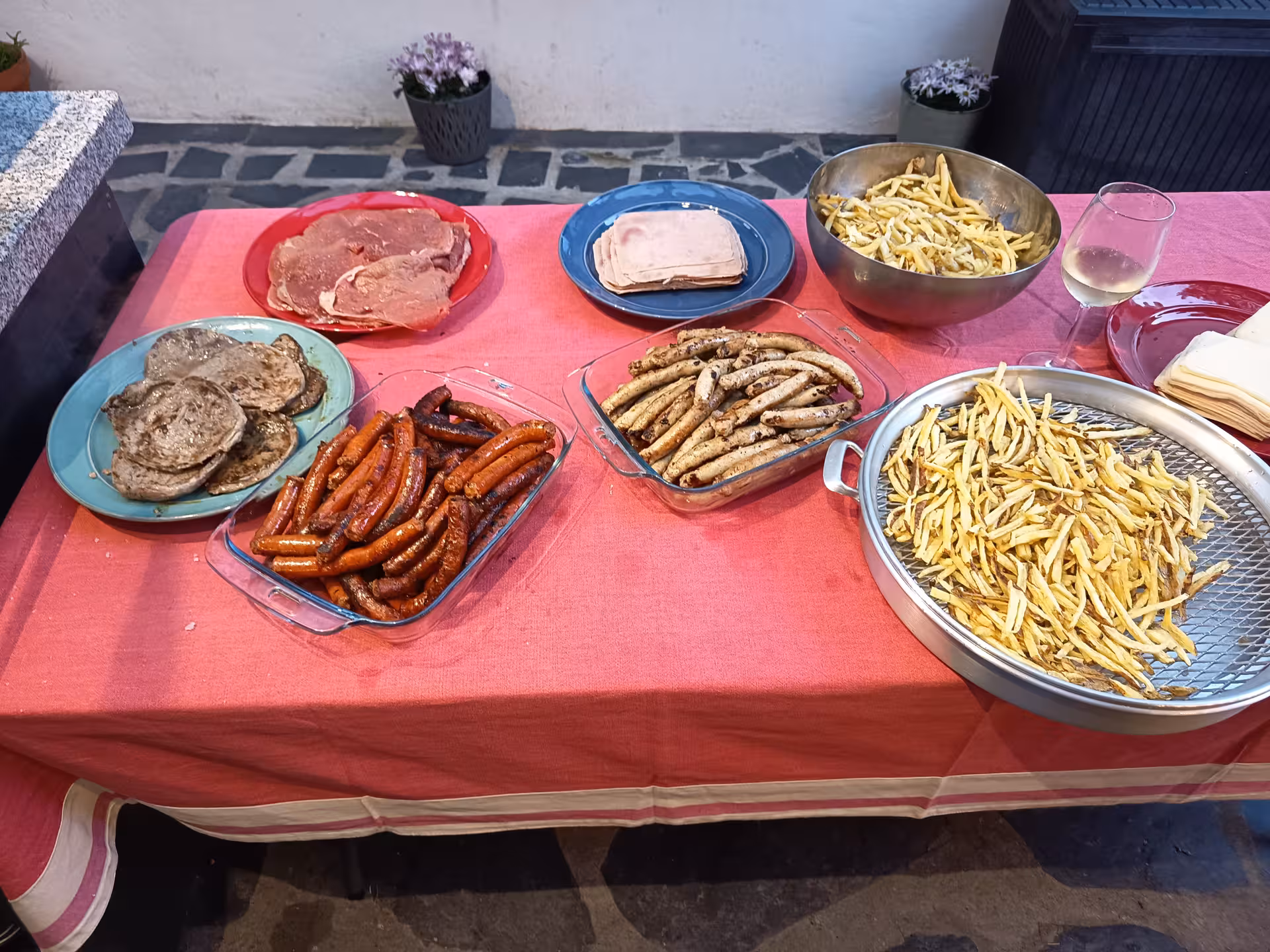 A vibrant spread of meats, sausages, and fries on display at Porto cooking class with Jorge and Isabel.
