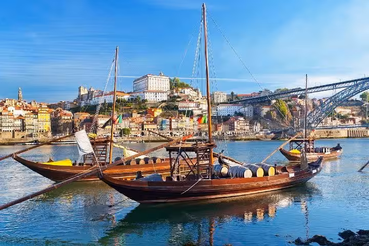 Sail the Douro River on traditional rabelo boats with scenic Porto views on a private two-day tour from Porto.