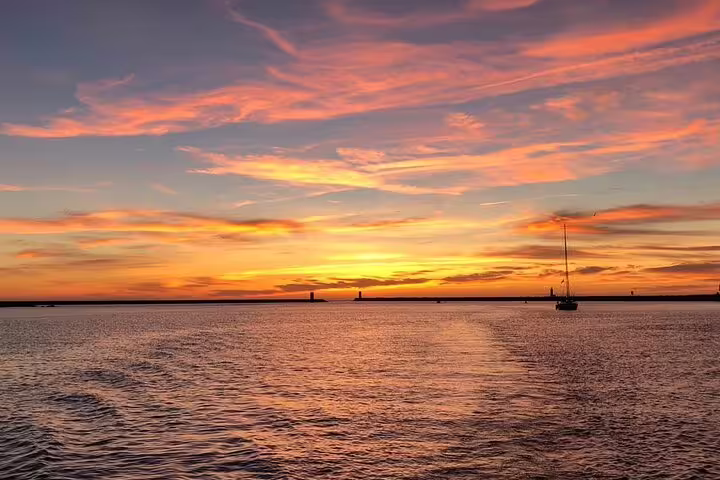 Tranquil Douro River scene at sunset with colorful skies, perfect for a private sea tour and sunset adventure.