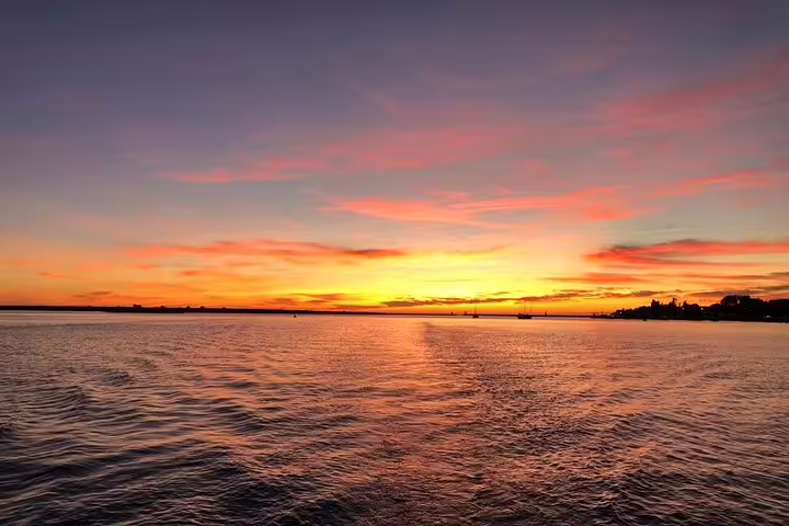 Serene sunset view over the Douro River with colorful skies, ideal for a private river and sea tour at dusk.