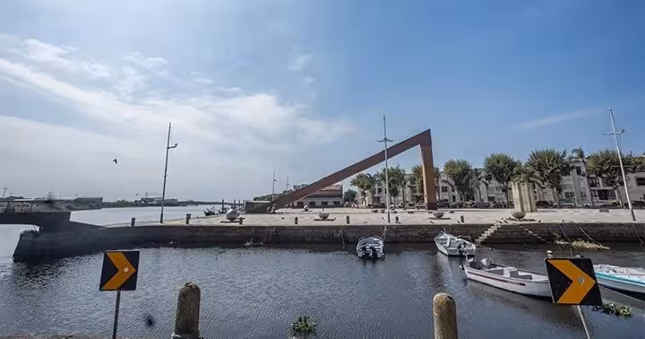 Porto north coast stop by the Douro riverfront marina and modern bridge on vintage car tour