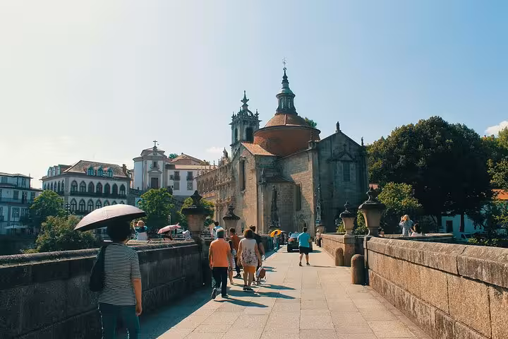 Travelers walking in Porto historic center before Douro Valley wine tour with private group, lunch and river cruise