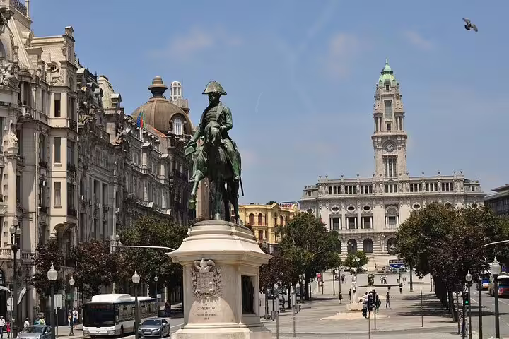 Historic equestrian statue in Porto's city center, highlighting architectural beauty and cultural landmarks.