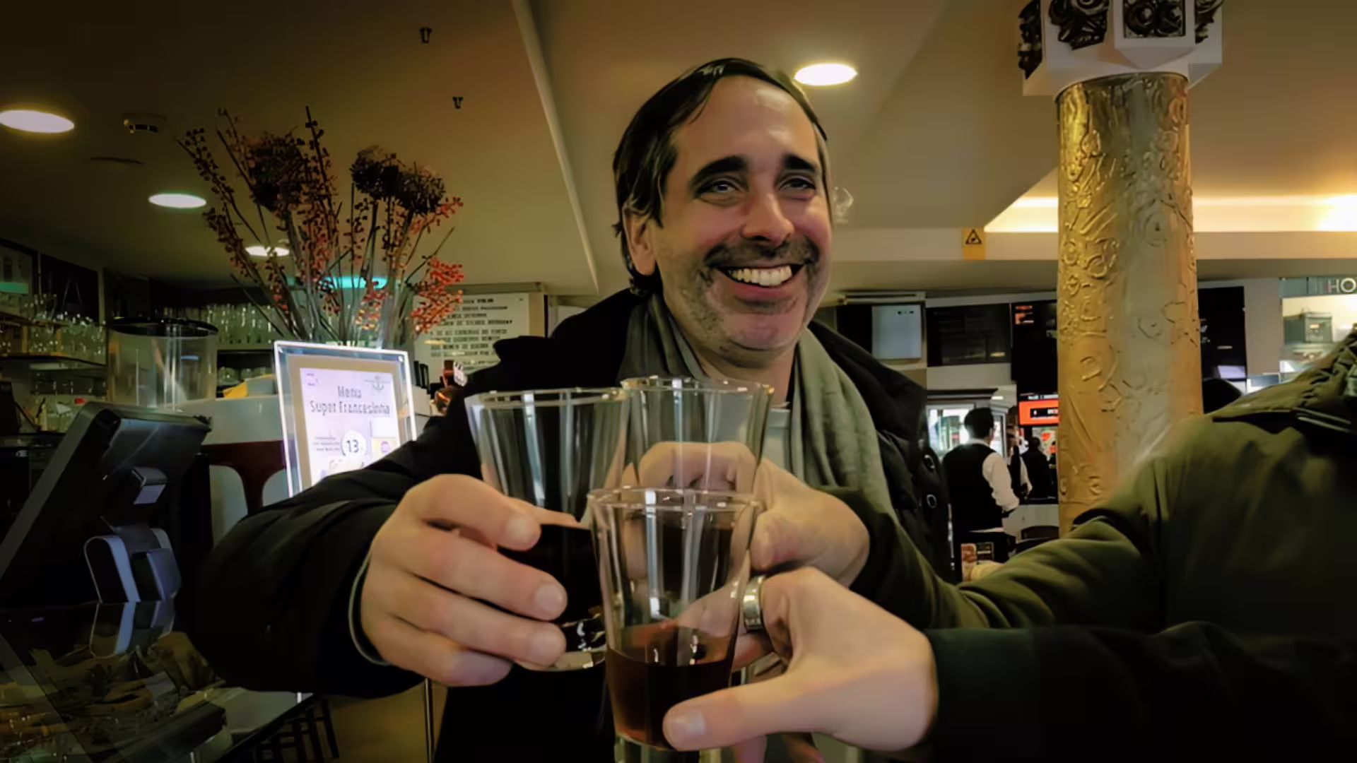 Image of guests taking an aperitif at a century-old café on Cooltour Oporto's Porto Fado & Wine Tour