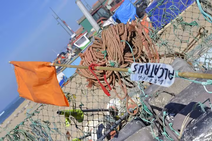 Fishing nets and ropes with an orange flag at a Porto harbor, showcasing a typical scene from the Fish Tour Private Experience.