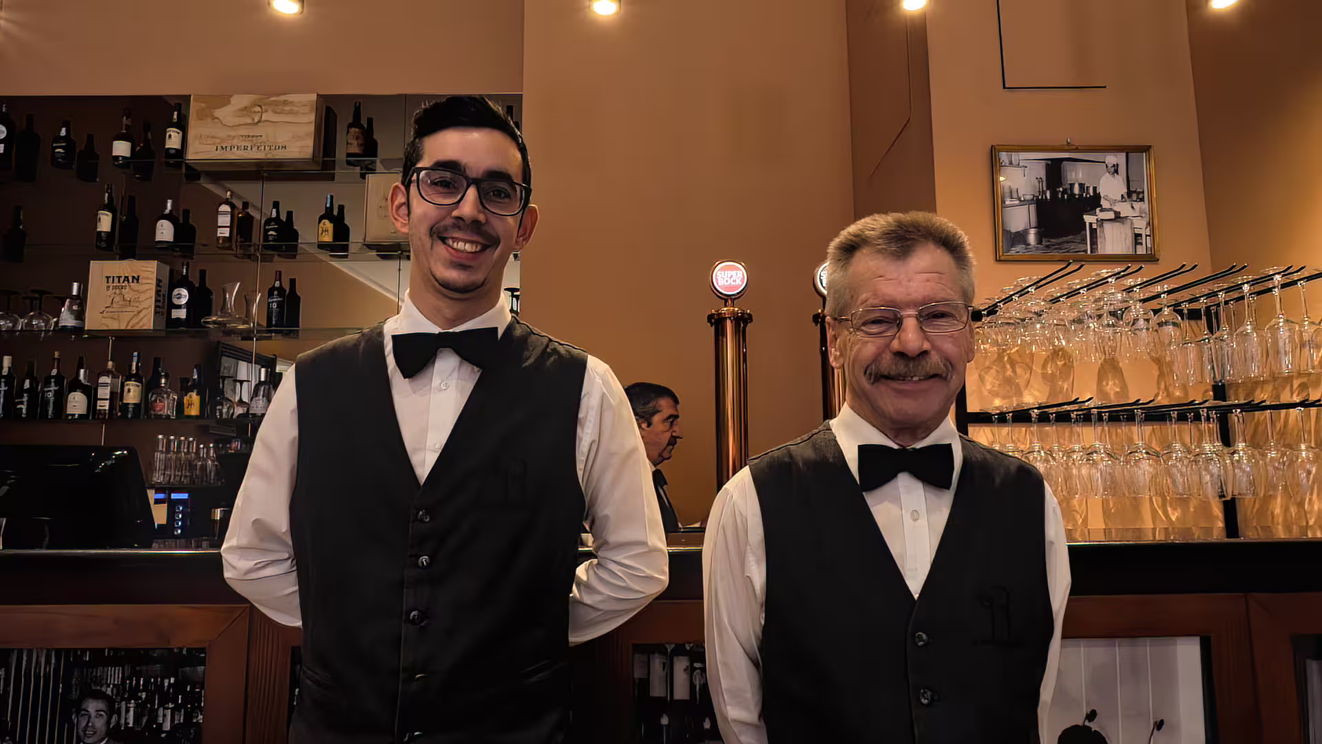 Smiling waiters with the original Francesinha restaurant in the background, Cooltour Oporto's Porto Food Tour