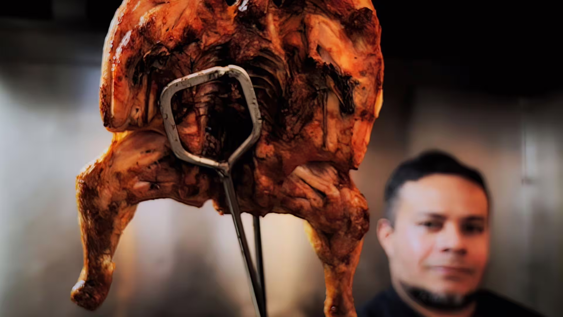 Server presenting grilled chicken for Portuguese Barbecue Food Tasting on Cooltour Oporto's Porto Food Tour