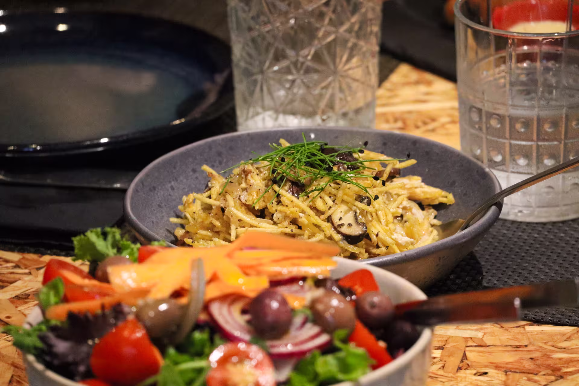 Delicious pasta and fresh salad served on a Porto food tour highlighting local culinary delights.
