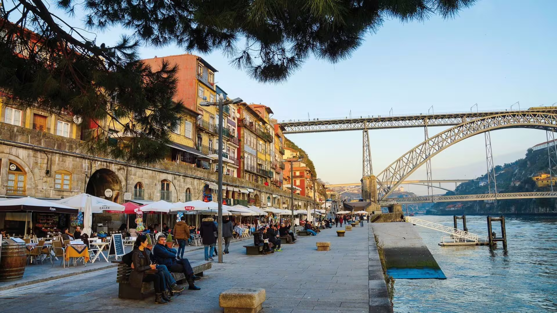 Scenic view of Ribeira, the Luis I Bridge, and the Douro River, endpoint of Cooltour Oporto's Porto Food Tour where a surprise awaits