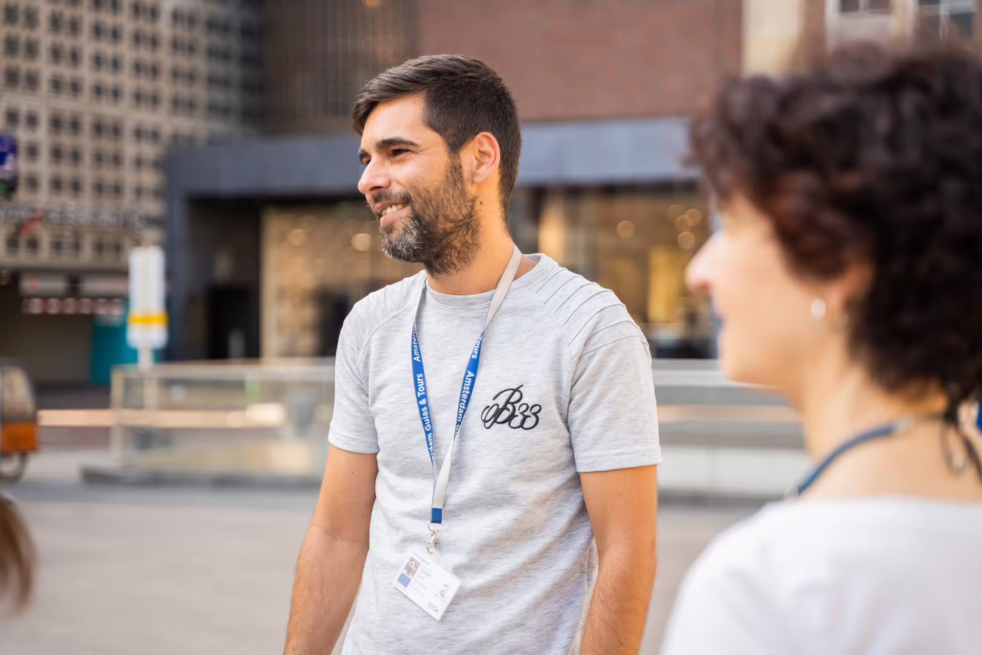 Tour guide engaging with visitors during the Porto and Gaia walking tour along the scenic Douro riversides.