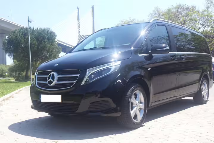 Luxurious black van for Porto to Lisbon private journey, offering direct route or customizable stops for a tailored travel experience.