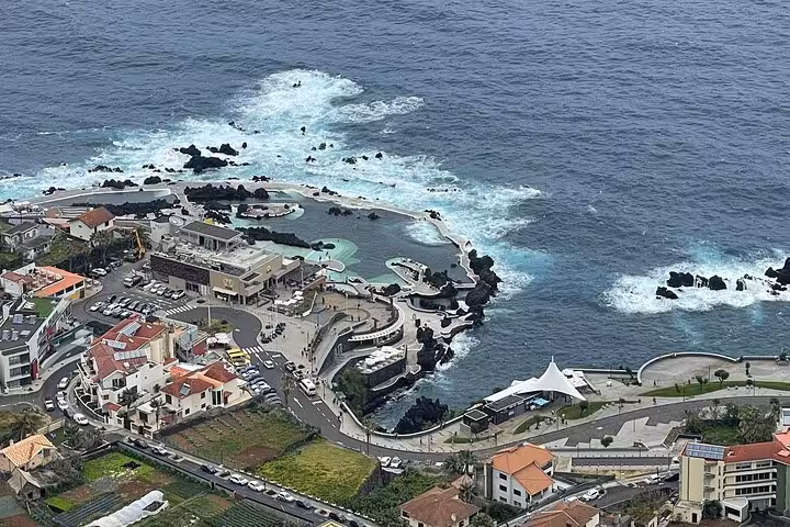 Aerial view of Porto Moniz natural lava pools and Atlantic coastline, a highlight of the West Madeira 4x4 tour