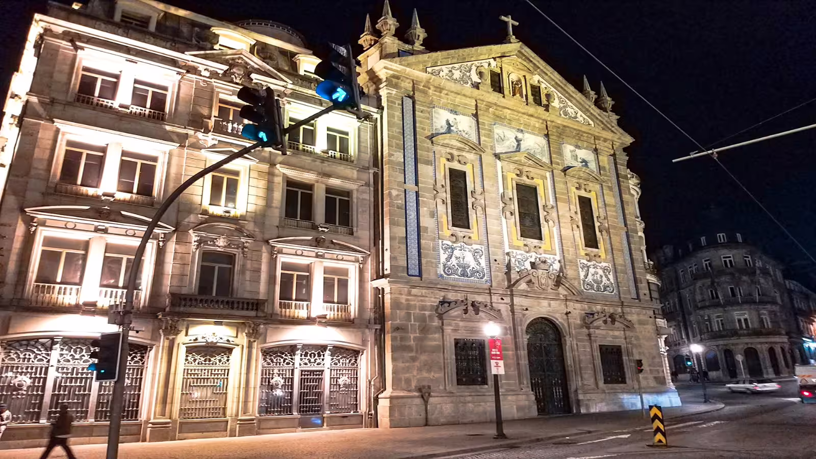 Illuminated historic architecture in Porto at night, showcasing iconic facades on a private city tour for unforgettable experiences.