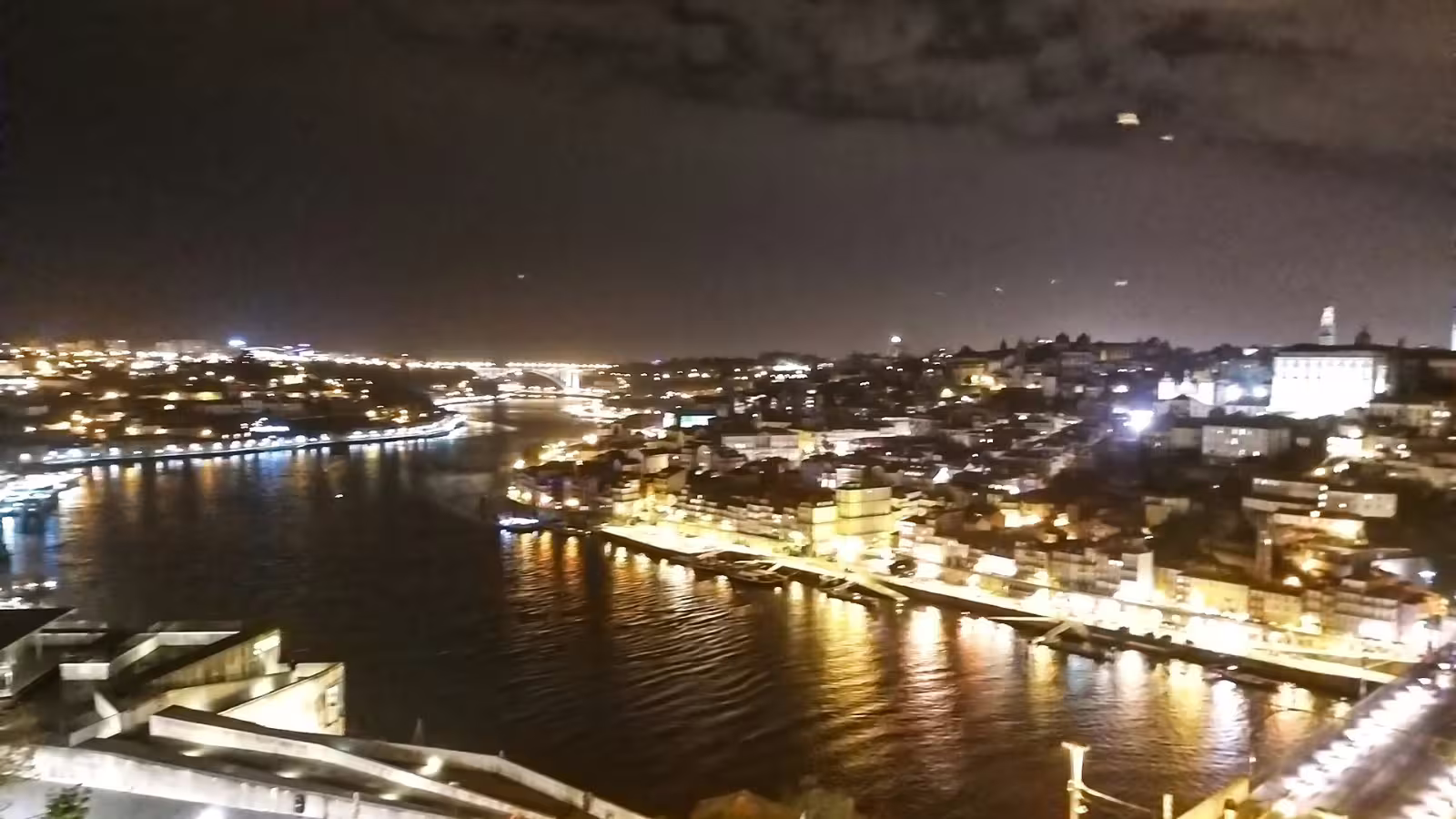Stunning night view of Porto's illuminated skyline and Douro River, perfect for a private night tour of iconic attractions.