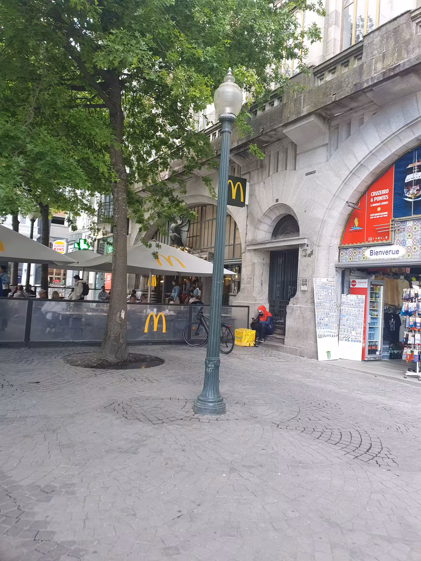 Relax at Porto's inviting outdoor cafes near iconic landmarks, perfect for discovering Portugal's charming tales.