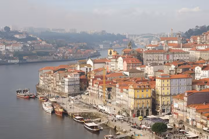 Scenic view of Porto's Ribeira District along the Douro River, featured in the 7-day guided tour from Madrid.