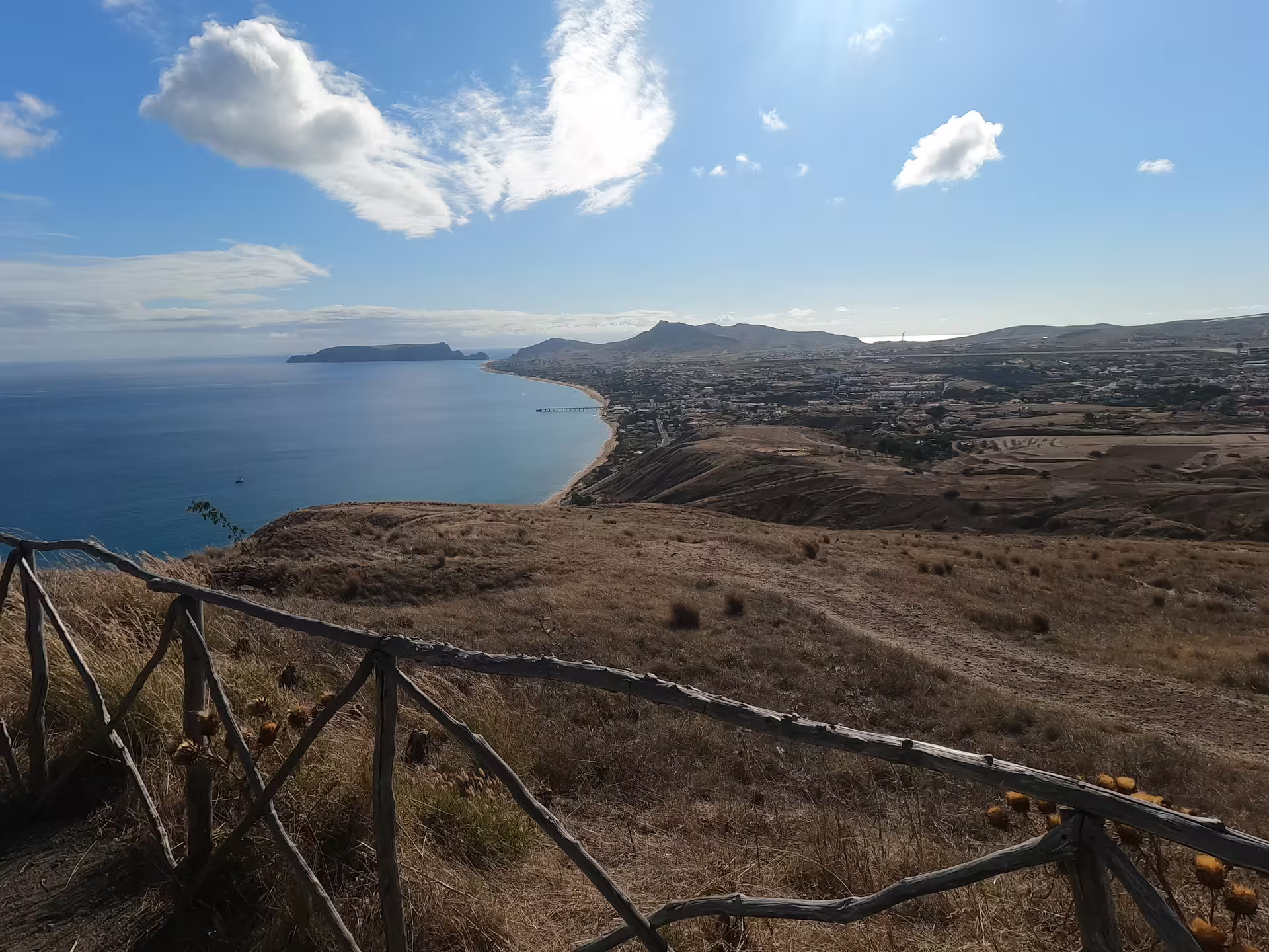 Stunning panoramic view of Porto Santo's coastline and hills under a clear sky, perfect for a half-day island tour experience.